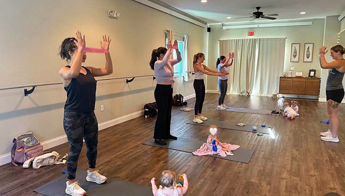 Small group fitness class with resistance bands at Platinum