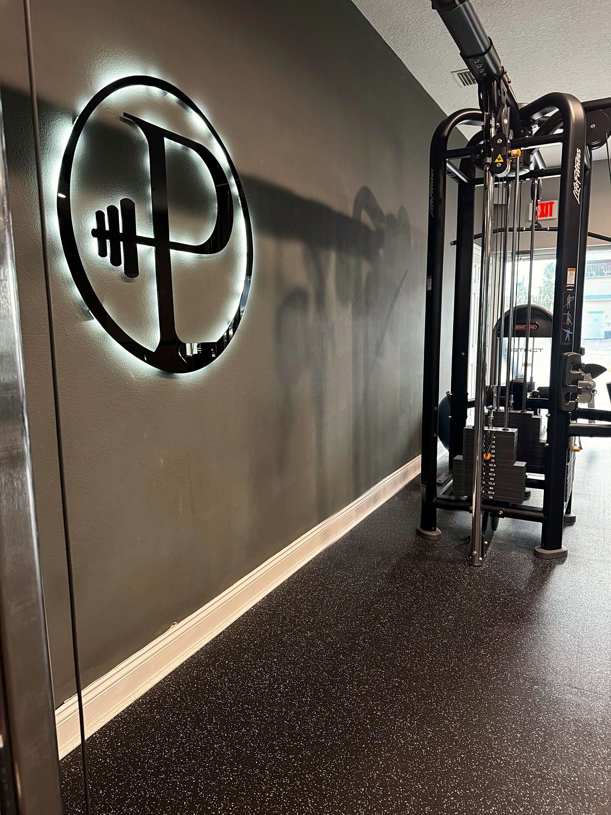 The Platinum training studio in Ormond Beach, with its backlit P logo